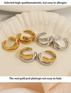 Macro view of wave-shaped double layer ear cuffs in gold and silver with PVD plating