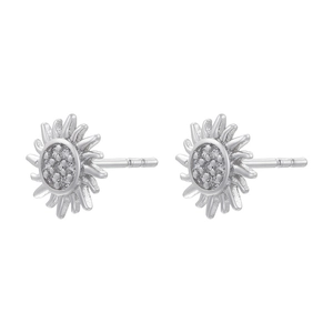 Macro detail of silver sunflower stud earrings with shimmering inlaid crystals