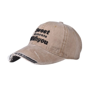 Detail of washed khaki baseball cap with frayed brim and Sweet Moments Withyou embroidery