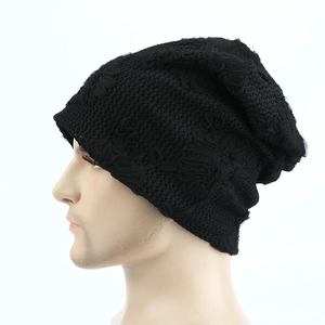 Close-up of black lace slouchy beanie featuring breathable floral jacquard pattern detail