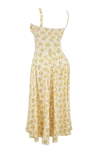Detail of floral backless dress in cream with yellow print and asymmetric shoulder strap