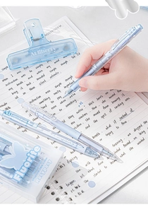 Detailed shot of RosyPosy Fluorite gel pen writing on notebook with binder clip