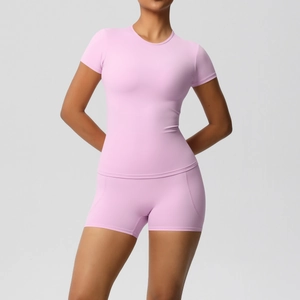 Detail of high-waist yoga shorts and fitted short sleeve top in soft lavender breathable fabric