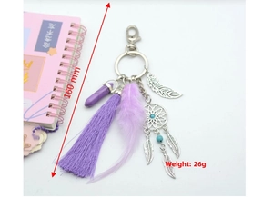 Detail of purple dreamcatcher keychain with cotton tassels and 160mm total length
