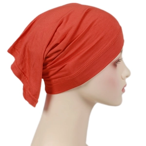 Detail view of red modal hijab cap fabric texture on side-facing model mannequin