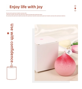 Detailed view of pink peach scented candle with gift box and white silk background