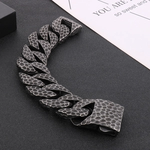 Close-up of vintage hammered texture and industrial clasp on the titanium steel bracelet