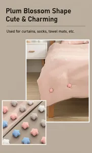Detail of flower-shaped duvet clips on bedding and multi-color fabric fastener collection