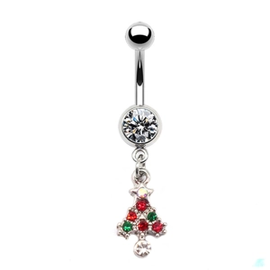 Macro shot of silver navel ring featuring a festive Christmas tree pendant with colored zircons