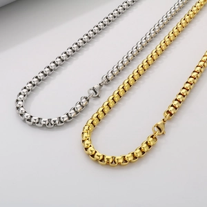 Detail of silver and gold stainless steel box chains with classic lobster clasps