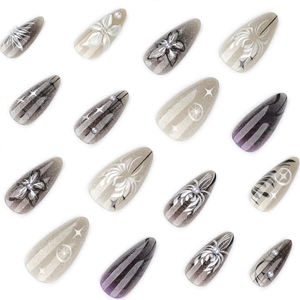 3D floral press-on nails with black smoke cat-eye effect and pearl accents