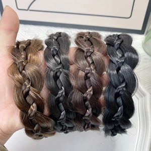 Braided fishtail headband with non-slip teeth in light brown, dark brown, and black hair