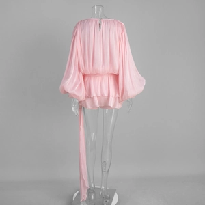 Pink chiffon dress detail featuring lantern sleeves and ruffled hem with back view