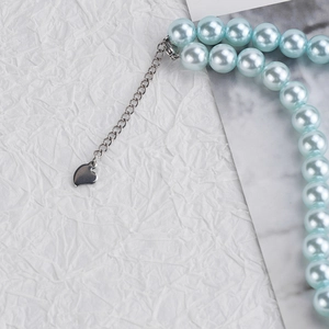 Light blue pearl necklace with silver heart pendant and adjustable extension chain