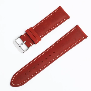 Detailed view of red Crazy Horse leather watch strap with contrast white stitching