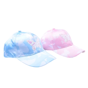 Close-up of pink and blue kids' baseball caps with butterfly sequins and satin prints