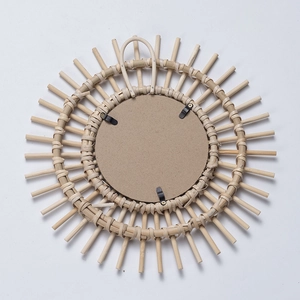 Handwoven rattan round wall mirror with sunburst design and sturdy metal hanging hook