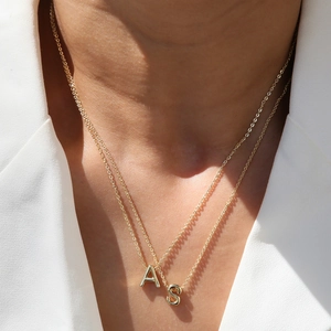 Classic 18k gold plated necklace featuring double layers with letters A and S pendants