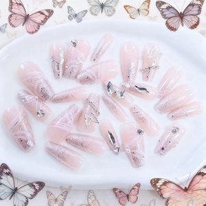 Pink coffin press-on nails featuring silver glitter, 3D metal butterflies, and pearls