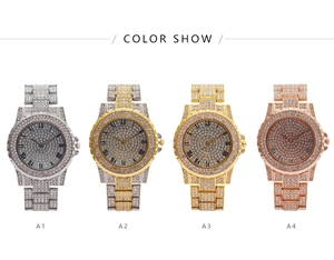 Row of four luxury crystal-encrusted watches in silver, gold, and rose gold finishes