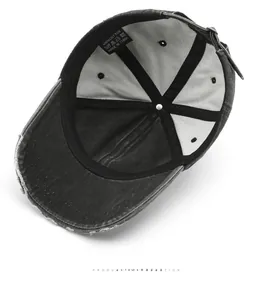 Detail view of cotton baseball cap interior showing stitching and metal buckle
