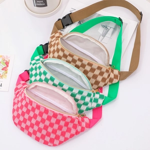 Detail of checkered knit waist bags featuring adjustable straps and gold metal zippers
