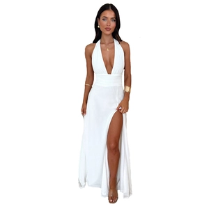 Detail of white deep V-neck halter maxi dress with high side slit for summer beach wear