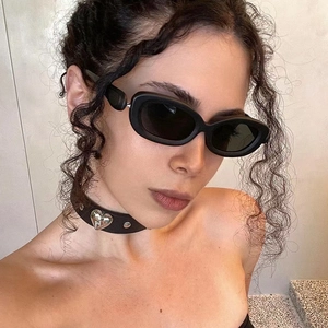 Y2K style black oval sunglasses and a punk heart choker set for a modern edgy look