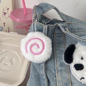 Cute plush fish cake pendant with pink spiral on a denim bag, creative gift for girls