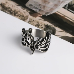 Macro detail of retro phoenix carving on silver titanium steel ring with hollow design