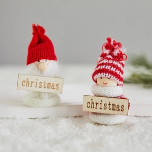 Handmade Christmas felt dolls with wooden signs on snowy base for holiday tree decoration