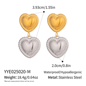 Detail shot of heart-shaped stainless steel earrings in gold and silver finish