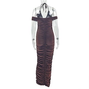Detail of dark brown ruched maxi dress featuring a halter neck and an open back design