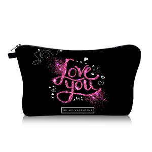 Macro shot of Valentine's day makeup bag with Love You glitter text and sturdy zipper