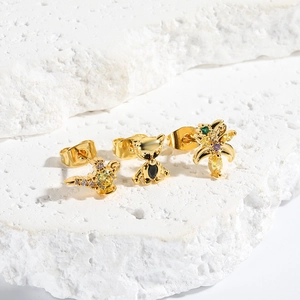Golden animal earring set with bear, wing, and plant designs featuring colorful zircon