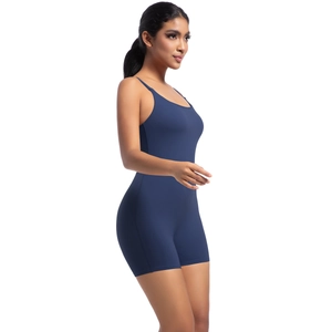 Side view of navy blue elastic yoga bodysuit with thin straps and a tight fit