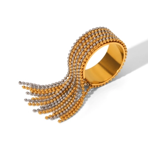 Detail of bicolor gold and silver fringe ring with elegant metallic bead chains