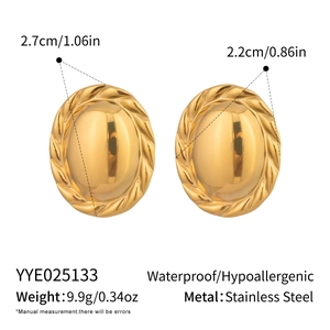 Detail showing dimensions and specifications for gold oval twisted texture earrings