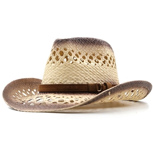 Detail of hand-woven straw cowboy hat with gradient edges and suede buckle band