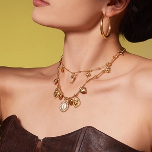 Gold bohemian layered necklace set with heart owl pendants and Saint icon coin