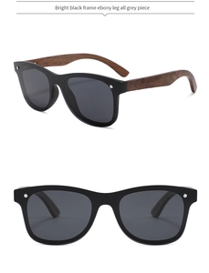 Detail of ebony wood temples and glossy black frames on polarized sunglasses