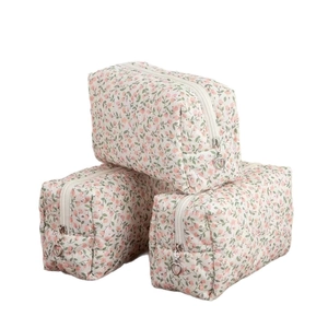 Floral makeup bag set with pink blossoms and heart-shaped metal zipper pullers