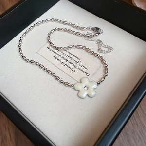 Detail of flower pendant necklace with rhinestone in black jewelry gift box
