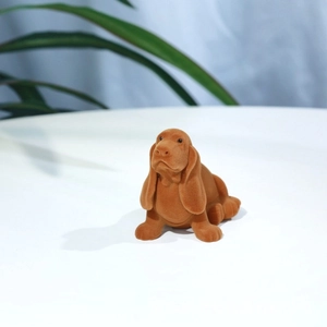 Close-up of cute brown flocked puppy jewelry box with realistic Bassett Hound shape