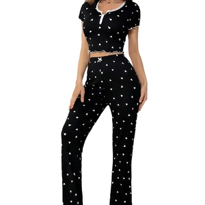 Women's black pajama set with white heart print, lace V-neck top and long pants