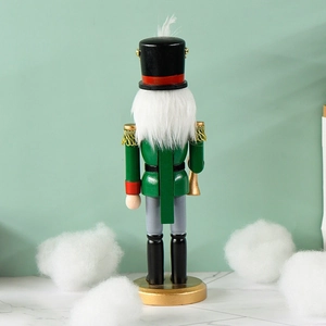 Rear view of 25cm green wooden nutcracker soldier with gold trumpet on snow background