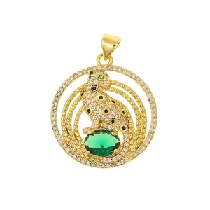 Detail of luxury leopard pendant with green gemstone and sparkling zircon accents