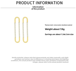 Detail view of gold U-shaped earrings featuring micro-pave cubic zirconia and titanium steel