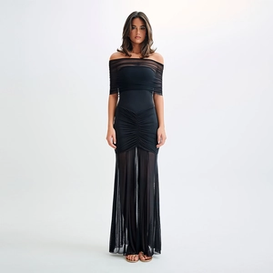 Detail showing the sheer mesh fabric and pleated texture of this black maxi dress