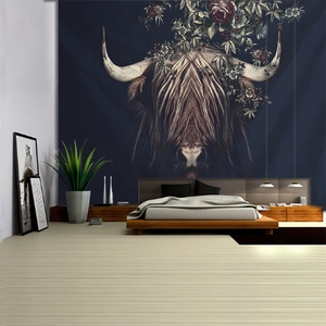 Detail of artistic highland cow wall tapestry with floral horns hanging in a bedroom